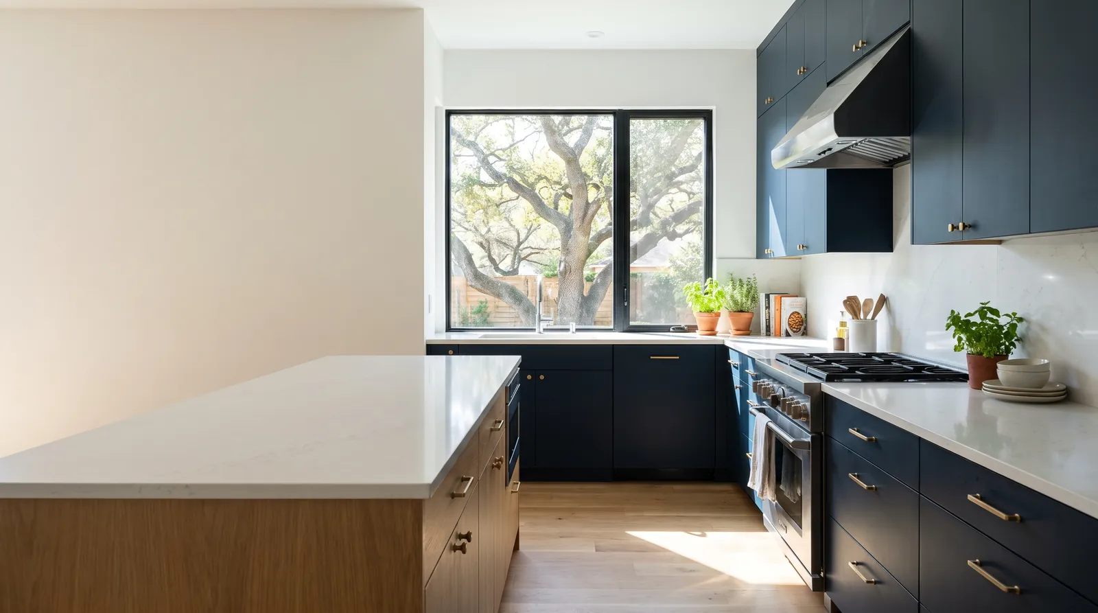 Remodeled kitchen with navy cabinets and a white oak island